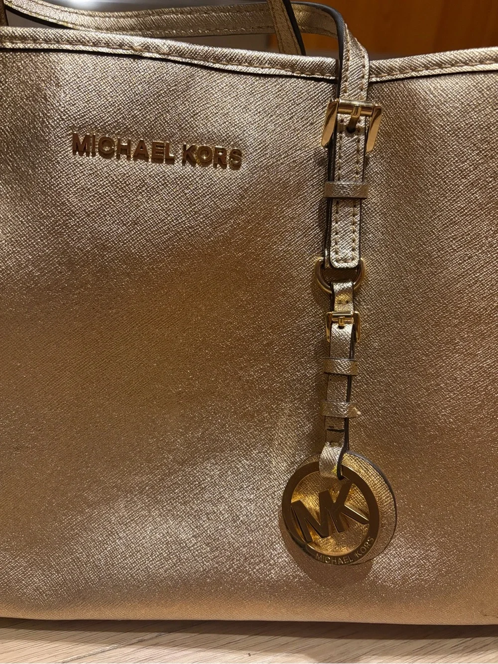 Authentic Michael Kors Metallic Gold Saffiano Tote with Logo Charm